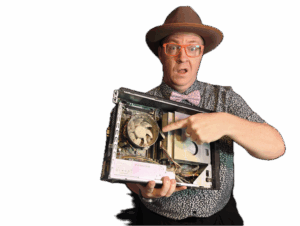 Tony Whitney holding and pointing to a computer fan clogged with dust in Lethbridge, AB